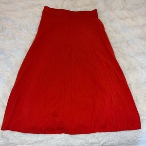 Red ribbed sweater midi skirt. Color is an orangish red. Soft and cozy, NWT.